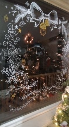 a window decorated with christmas decorations and lights