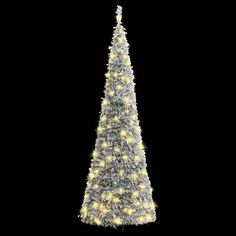 a white christmas tree with lights on it