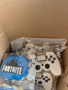 a box filled with cookies and video game controllers