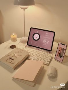 an open laptop computer sitting on top of a white desk