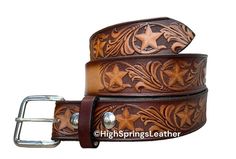 * Name Belt Star embossed brown leather belt 1 1/2" wide with name laser engraved free on center back (visible) for Men and Women  * Our belts are cut with the design facing up and when you put the belt on .. you start to the left.  If you need a left handed belt not a problem; please let us know when checking out * Made in High Springs, Florida * 100% high quality one-piece full grain cowhide leather; includes plain silver buckle and leather loop; we use snaps so you can change buckles * Please High Springs Florida, One Piece Full, Springs Florida, Brown Leather Belt, Suspender Belt, Antique Finish, Left Handed, Belt Size, Custom Engraving