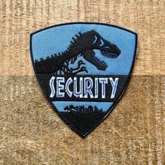 a security badge on a wooden surface