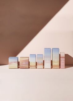 a row of wooden blocks sitting on top of a white table next to a wall