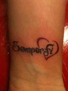 a small wrist tattoo with the word sempero on it