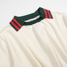 - Knitted Polo- 100% cotton yarn- Unlined- Regular fit- Machine washable Fabric & Care- Delicate Machine Wash at 30 degrees(86℉) with similar colors.- Iron inside out on low temperature.- Store flat.- Do not tumble dry.- Do not bleach. Casual Striped Collar Crew Neck Top, Casual Crew Neck Top With Striped Collar, Green Cotton Polo Sweater For Fall, Spring Preppy Cotton Sweater, Knit Long Sleeve Top With Striped Collar, Preppy Spring Knit Tops, Preppy Knit Tops For Spring, Spring Preppy Knit Tops, Trendy Green Sweater With Ribbed Collar