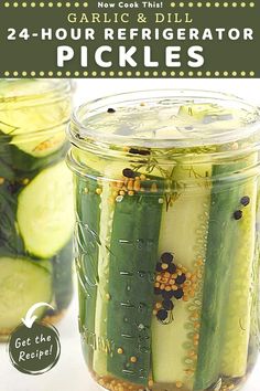 two jars filled with pickles on top of a table