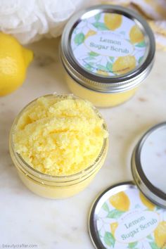 three jars of lemon sugar sitting on a counter