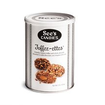 an open can of cookies with nuts on top