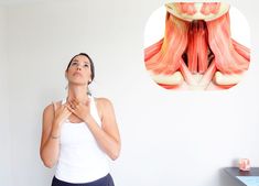 a woman standing in front of a wall with her hands on her chest and an image of the muscles