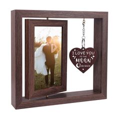 a wooden frame with a keychain attached to it and an i love you to the moon and back photo