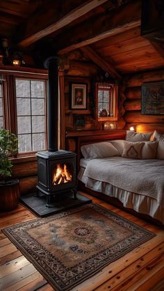 a bedroom with a bed and a wood stove in the corner next to a window