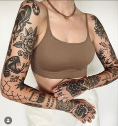 a woman with many tattoos on her arms