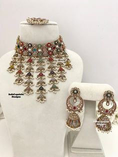 Elegant antique gold Polki Choker Set with beautiful Jhumki earrings and Tikka/Indian Jewelry/ High quality kundan Polki jewelry/trendy unique choker/rainbow/multi color  All items are shipped from Brampton, Ontario, Canada. If you need your item by a certain day, please reach out to us for express delivery option before placing the order so that we can update the shipping for you. Standard shipping/delivery timeline Below are the estimated delivery times after the order is shipped/dispatched. Ceremonial Multicolor Kundan Chandbalis, Heavy Multicolor Temple Jewelry Bridal Sets, Heavy Gold Kundan Lehenga, Gift Gold Lehenga With Meenakari Detail, Gold Meenakari Lehenga For Gift, Heavy Kundan Lehenga For Celebration, Traditional Lehenga For Festivals With Hand Set Details, Heavy Chandbali Jewelry Sets For Ceremonial Occasions, Gold Lehenga With Stone Work For Festivals