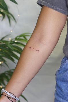 a woman's arm with a tattoo that says, i love you on it