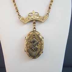 Very old beautiful 9k solid yellow and rose gold necklace that separates from the support bar to become a photo Locket with Etruscan Design & Seed Pearls Unable to locate hallmarks but both the hand made Victorian Chain & Support Bar has been acid tested to verify purity of 9K Gold... The Oval Locket has Etruscan Wire Overlay Design with Seed Pearls on center crest and is wonderfully ornate it opens to show a photo of a Victorian Lady inside. The Hand Made Victorian Era circle link Chain measures 3.0mm wide and is in 9K Gold measures 21 Inches Long. This antique chain has two tongue and groove clasps which release from the 9K Gold ornately engraved cross bar when taken on and off. The Locket Pendant measures 1 1/2 inch High by 7/8 Inches Wide by 1/3 Inch Deep and is Gold Filled... The Lock Design Seed, Engraved Cross, Cross Bar, Antique Jewelry Necklace, Oval Locket, Victorian Lady, Design Seeds, Gold Hand, Photo Locket