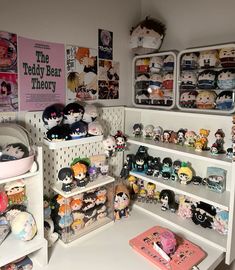 a room filled with lots of different kinds of dolls on shelves next to each other