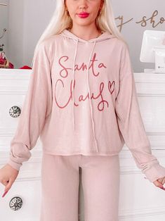 Santa Claus Christmas Pajamas PJ Set | Sassy Shortcake | sassyshortcake.com Cute Winter Hoodie For Loungewear, Winter Lounging Top With Drawstring Hood, Cozy Fit Tops With Drawstring Hood For Loungewear, Cozy Fit Lounge Tops With Drawstring Hood, Comfy Pink Hoodie For Loungewear, Pink Comfy Hoodie For Loungewear, Pink Cotton Christmas Sleepwear, Pink Drawstring Hood Top For Loungewear, Long Sleeve Letter Print Tops For Pajama Party