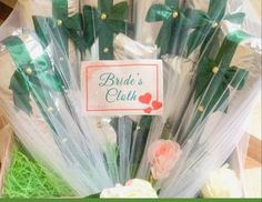 a bunch of flowers in a box with the name bride's cloth on it