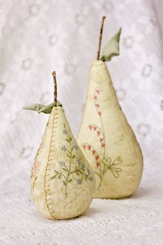 two pears sitting side by side on a table