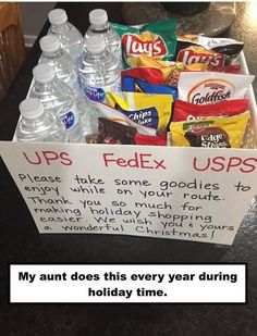 a box filled with snacks and water on top of a counter next to a sign that says ups fedex usps