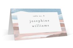 a place card with the words table no 8 in white and blue, on top of a