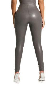 These faux-leather leggings feature a high, elastic waist and a body-hugging silhouette for a sleek and ultramodern look. 31" inseam; 7 1/2" leg opening; 11" front rise; 15 1/2" back rise (size Medium) 60% polyurethane, 35% rayon, 5% spandex Spot clean Imported Sleek Solid Color Faux Leather Leggings, Sleek Tight Faux Leather Leggings, Chic High-waisted Faux Leather Leggings, Sleek Full-length Faux Leather Leggings, Tight Faux Leather Full-length Leggings, Faux Leather Leggings, Leather Leggings, High Waisted Leggings, Elastic Waist