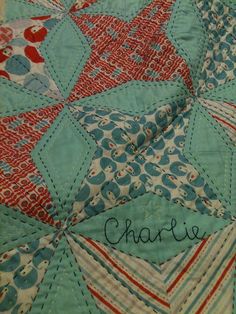 the name charlotte is written on a quilt