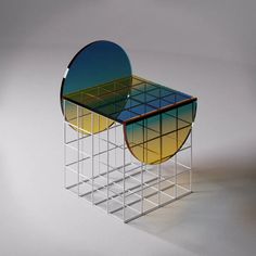 the cover of l'chair magazine features two circular tables with mirrored tops and sides