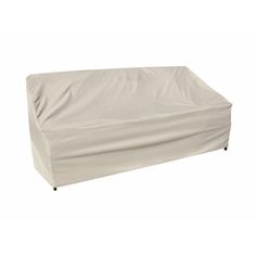 an outdoor furniture cover on top of a couch