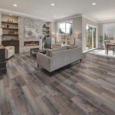 a living room filled with furniture and a fire place