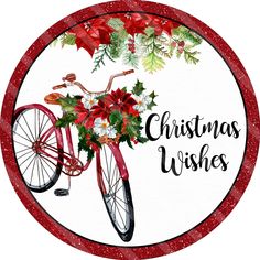 a christmas bicycle with poinsettis and holly on the front wheel is shown