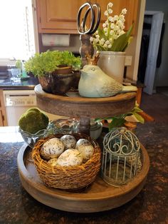 three tiered tray with eggs and plants on it