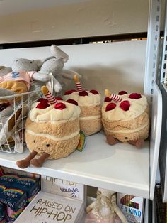 stuffed animals and other items on shelves in a store