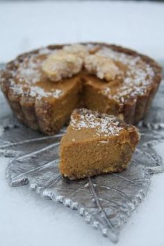 a piece of cake sitting on top of a metal pan covered in powdered sugar