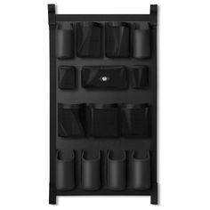 a black wall mounted organizer with cups and knives in it's holder, on a white background