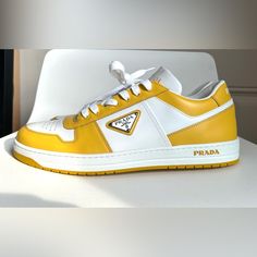 Nwot. Brand New. Never Worn. No Box. Just Shoes. Sold Out. Pls Know Your Size In Prada. 9.5. No Returns. Trims In A Bold Primary Color Zip Around The Silhouette Of This Low-Top Leather Sneaker Featuring A Perforated Toe And Three Versions Of The Iconic Prada Logo. Lace-Up Style Removable Insole Leather Upper/Leather And Textile Lining/Synthetic Sole Made In Italy Men's Designer Shoes Item #6886168 Ingredients Upper Content: 100%Calf Leather Outsole Content: 100% Rubber Ingredients Are Subject To Modern Custom Yellow Sneakers With Contrast Sole, Modern Yellow Custom Sneakers With Contrast Sole, Classic Yellow Sneakers With Rubber Sole, Designer Yellow Leather Custom Sneakers, Classic Yellow Sneakers With Round Toe, Designer Yellow Sneakers With Round Toe, Modern Yellow Low-top Custom Sneakers, Luxury Yellow Sneakers With Round Toe, Designer Yellow Leather Sneakers