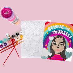 the coloring book is next to some markers and pencils on a pink background with an image of a woman's face