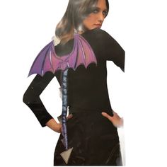 a woman in a black dress with purple bat wings