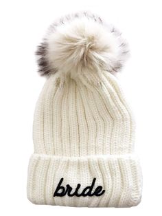 the bride beanie is shown in white with grey pom - pom on top