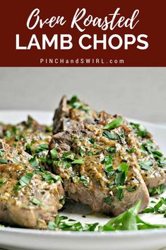 grilled lamb chops on a white plate topped with fresh herbs and parsley