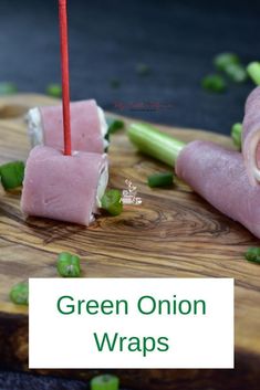 green onion wraps with toothpicks on a cutting board