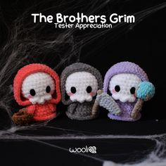 three little crocheted dolls sitting next to each other in front of a black background