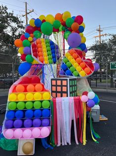 a car decorated with balloons and streamers