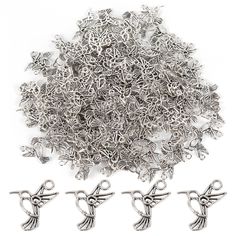 silver plated metal bird charms and hooks on a white background