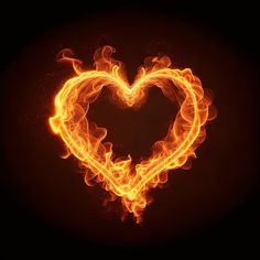 a heart shaped fire on a black background