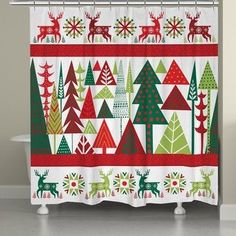 a shower curtain with christmas trees and deers on it