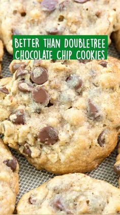 chocolate chip cookies sitting on top of a cookie sheet