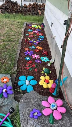 the garden is filled with colorful flowers and hoses