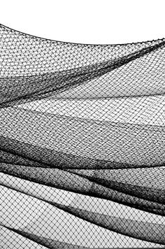 an abstract black and white photo of mesh