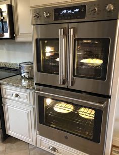 two ovens are built into each other in the kitchen